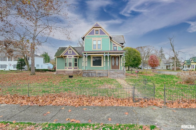 victorian house featuring covered porch