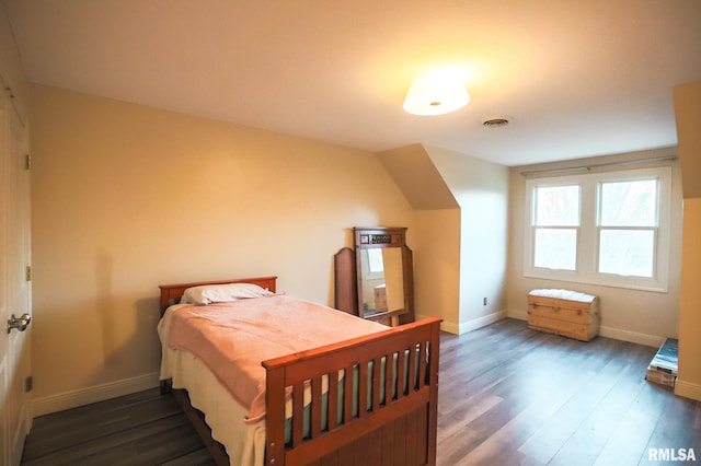 bedroom featuring dark wood-type flooring