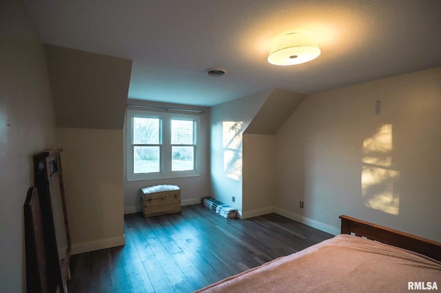 bonus room featuring dark hardwood / wood-style floors and lofted ceiling