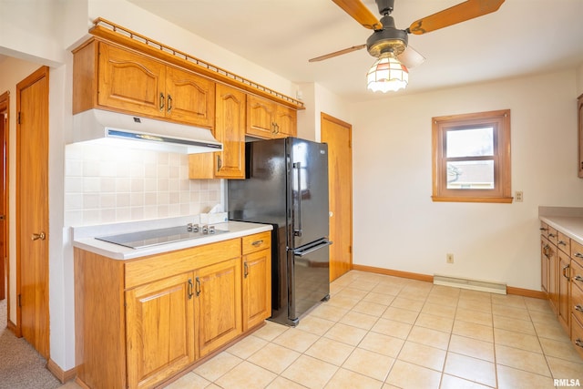 kitchen featuring tasteful backsplash, light tile patterned flooring, ceiling fan, and black appliances