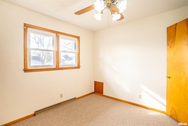 carpeted empty room featuring a baseboard radiator and ceiling fan