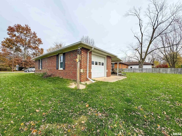 view of property exterior featuring a garage and a lawn