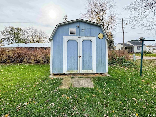 view of outdoor structure with a yard