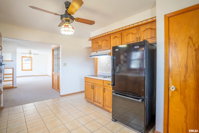 kitchen with tasteful backsplash, light colored carpet, ceiling fan, and black appliances