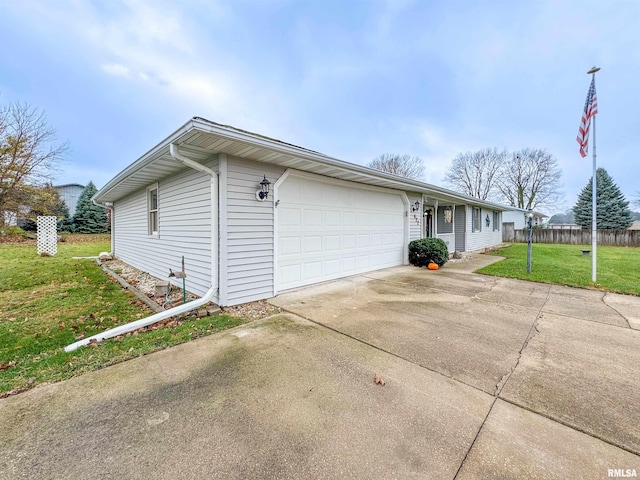 exterior space with a lawn and a garage