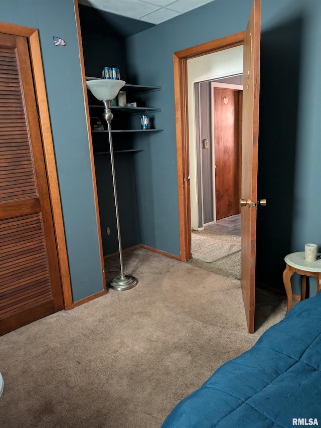 carpeted bedroom featuring a closet