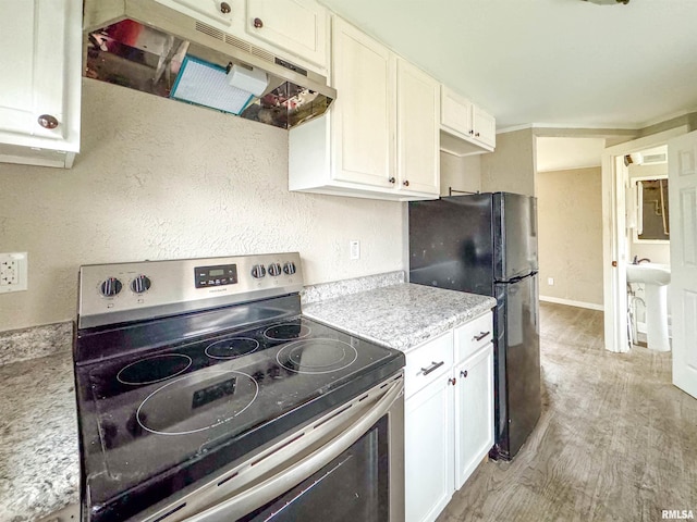 kitchen with white cabinetry, stainless steel electric range oven, light hardwood / wood-style flooring, and black refrigerator