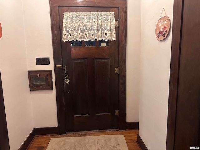 doorway with hardwood / wood-style floors