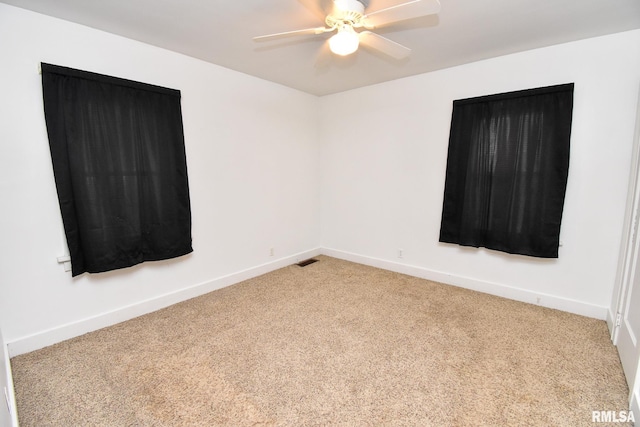 empty room with light carpet and ceiling fan