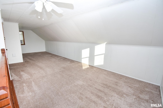 additional living space featuring carpet flooring, ceiling fan, and vaulted ceiling