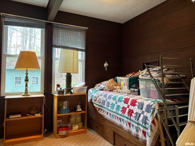 bedroom with wood walls