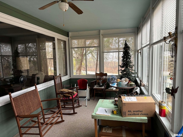 sunroom featuring ceiling fan