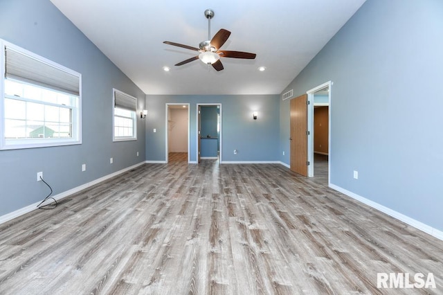 interior space featuring vaulted ceiling, ceiling fan, and light hardwood / wood-style flooring