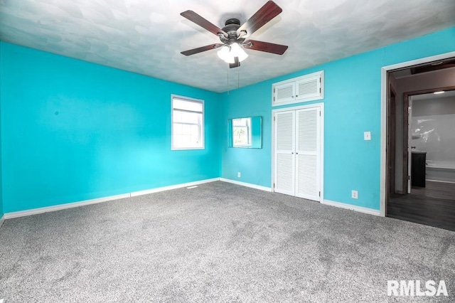 unfurnished bedroom with a closet, ceiling fan, and carpet flooring