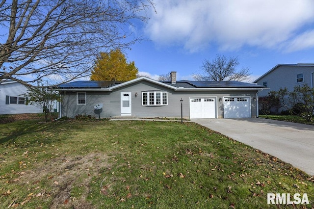 single story home with a garage, a front yard, and solar panels