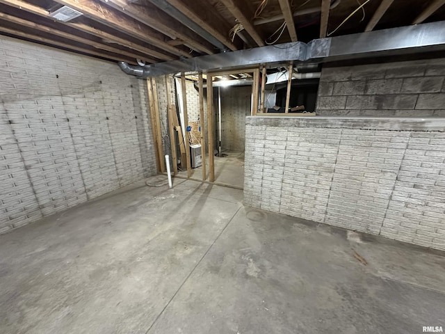 basement with brick wall