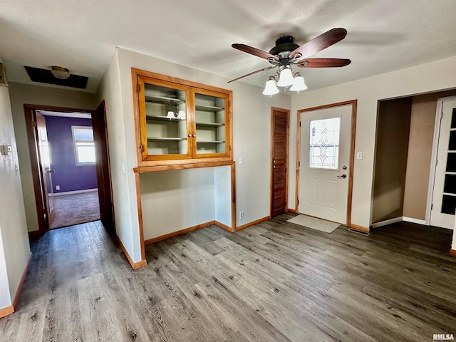 foyer entrance with hardwood / wood-style floors and ceiling fan