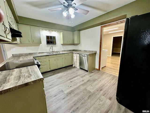 kitchen with sink, black refrigerator, stove, stainless steel dishwasher, and light wood-type flooring