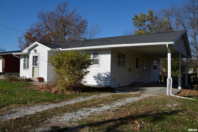 view of side of property with a carport