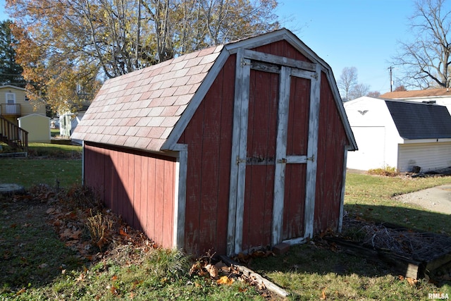 view of outdoor structure with a lawn