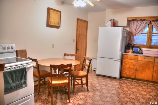 dining room featuring ceiling fan