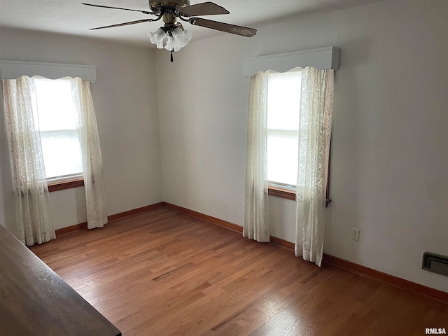 unfurnished room featuring ceiling fan and light wood-type flooring