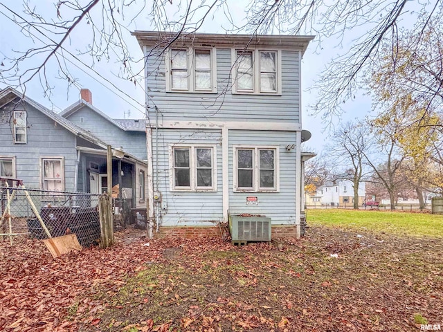 rear view of property with central AC unit