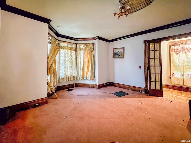 carpeted spare room with ornamental molding