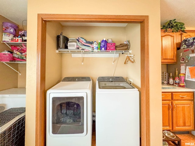 laundry area with separate washer and dryer