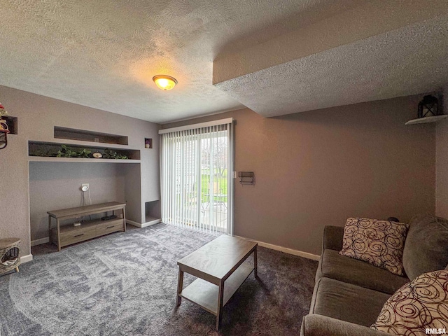 carpeted living room with a textured ceiling