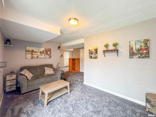 carpeted living room with a textured ceiling