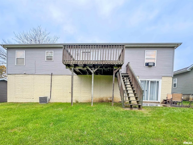 rear view of house with a yard, cooling unit, and a deck