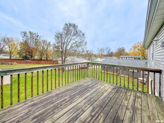 wooden deck featuring a yard