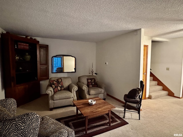 living area with stairs, a textured ceiling, light carpet, and baseboards