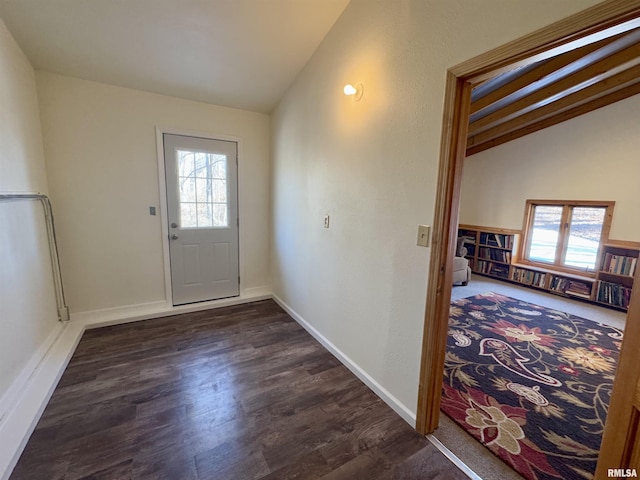 10110 E 850th St, Colchester, IL 62326 - doorway with healthy amount of natural light, vaulted ceiling, dark wood-style floors, and baseboards