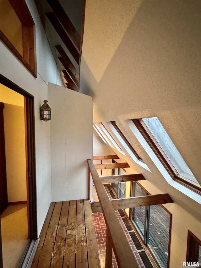 10110 E 850th St, Colchester, IL 62326 - stairway with a skylight, brick patterned flooring, and lofted ceiling