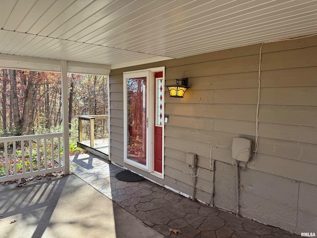 unfurnished sunroom with a wealth of natural light and wood ceiling