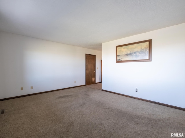 empty room with carpet flooring