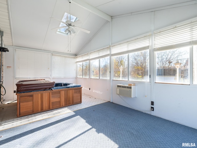 sunroom / solarium with vaulted ceiling with beams, a wall unit AC, ceiling fan, and a healthy amount of sunlight