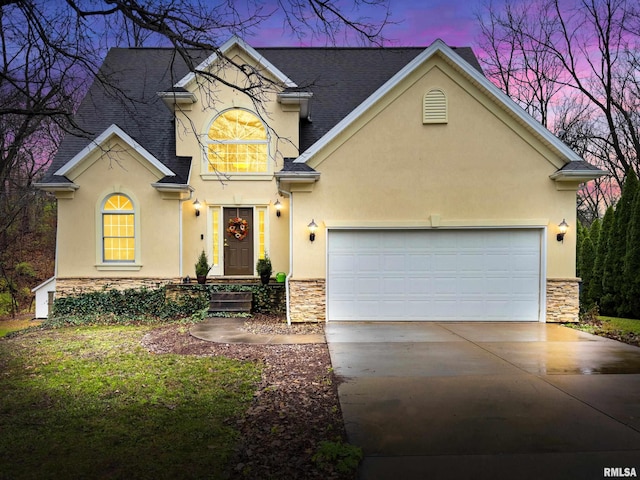 view of front of home with a garage