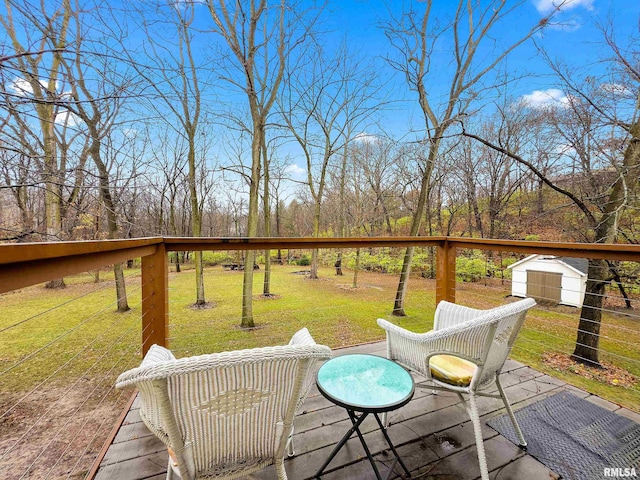 wooden deck with a storage shed and a lawn