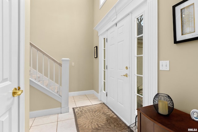 entryway with light tile patterned floors