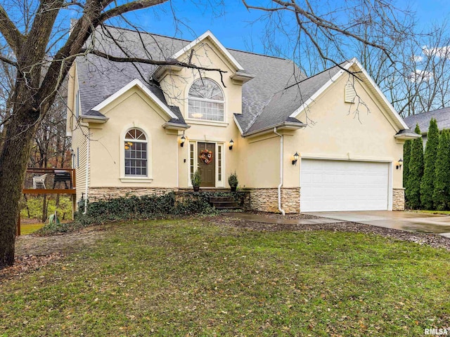 view of front property featuring a garage and a front lawn