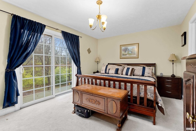 carpeted bedroom featuring a notable chandelier