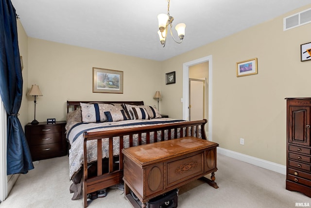 carpeted bedroom with an inviting chandelier