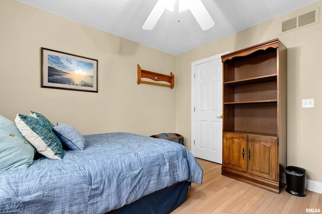 bedroom featuring ceiling fan and light hardwood / wood-style flooring