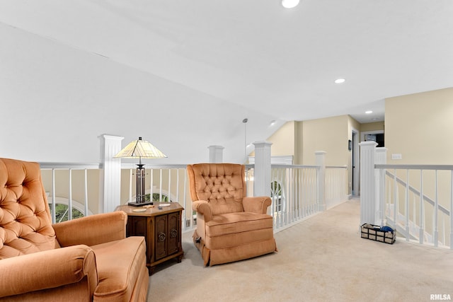 living area with light colored carpet and lofted ceiling