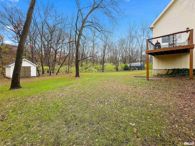 view of yard with a balcony and a shed