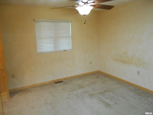 carpeted empty room with ceiling fan