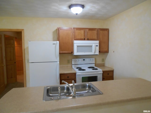 537 N Washington St, Bushnell, IL 61422 - kitchen with white appliances, a sink, light countertops, and brown cabinetry